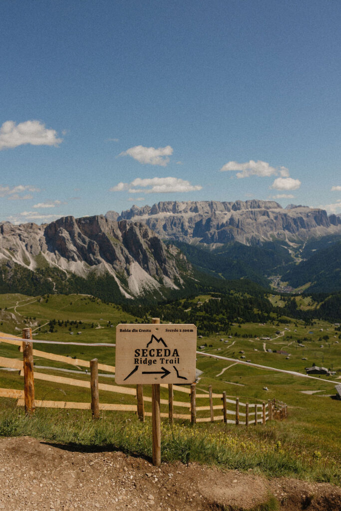 Trail markers on Seceda ridge guiding hikers through the Dolomites