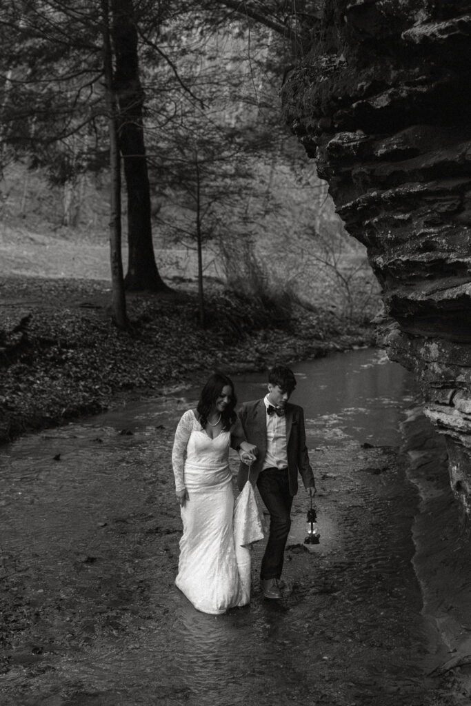 A son walking his mom across a river to her elopement ceremony 