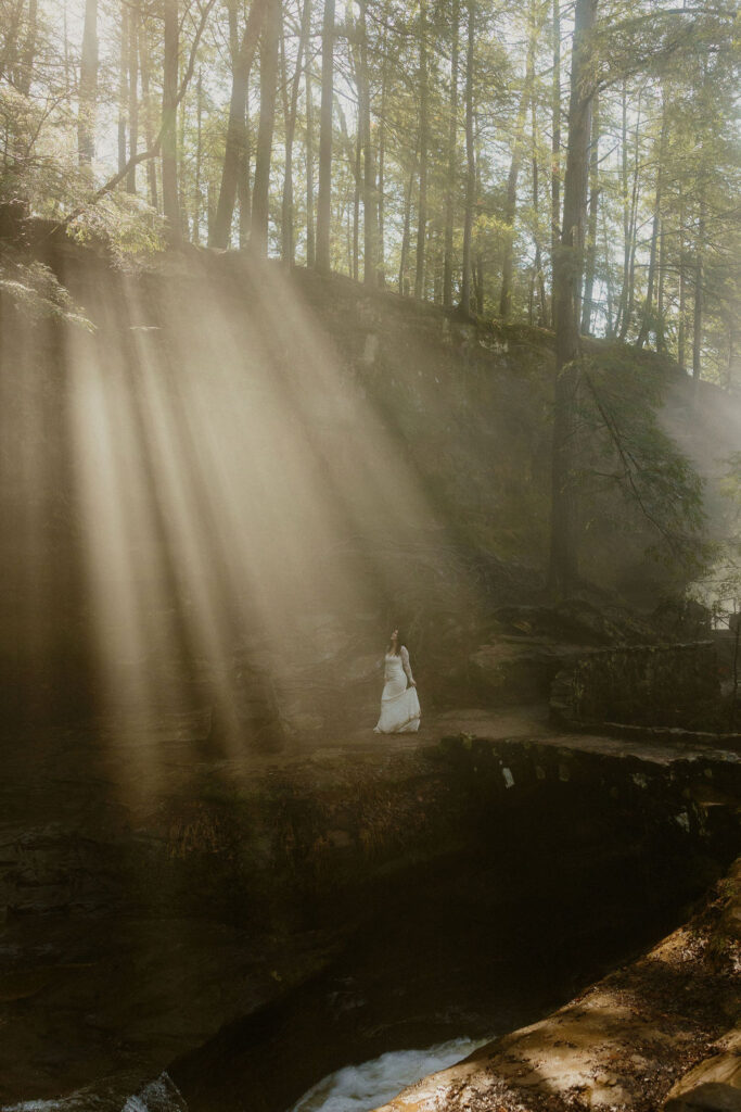 Bride on a bridge surrounded by fog in Hocking Hills