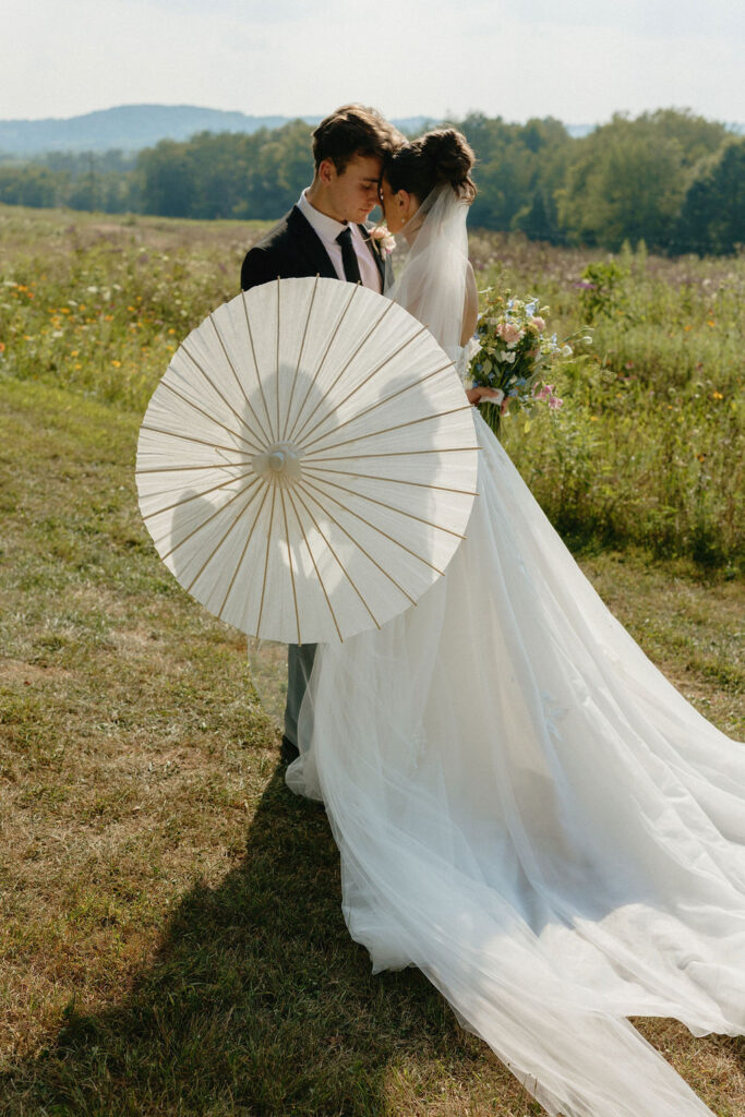Parasol shadow of a bride and groom at Magnolia Spring Farm