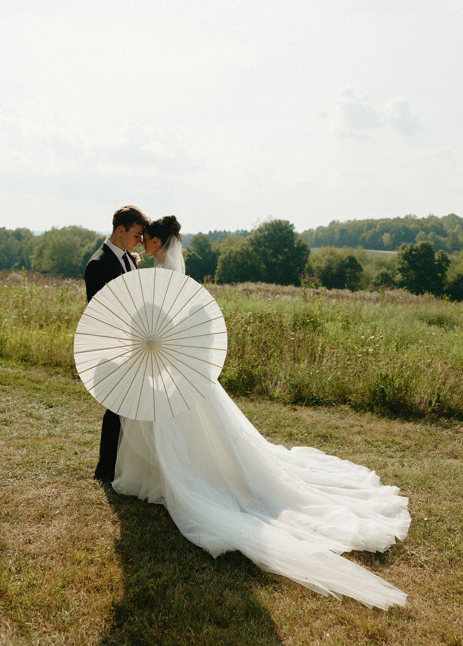 Parasol portrait of a bride and groom at Magnolia Spring Farm