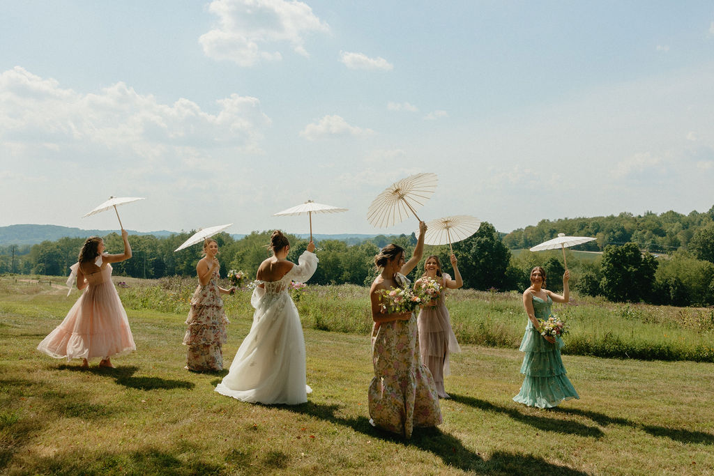 Bridesmaids twirling around the hills on Magnolia Spring Farm in Ohio
