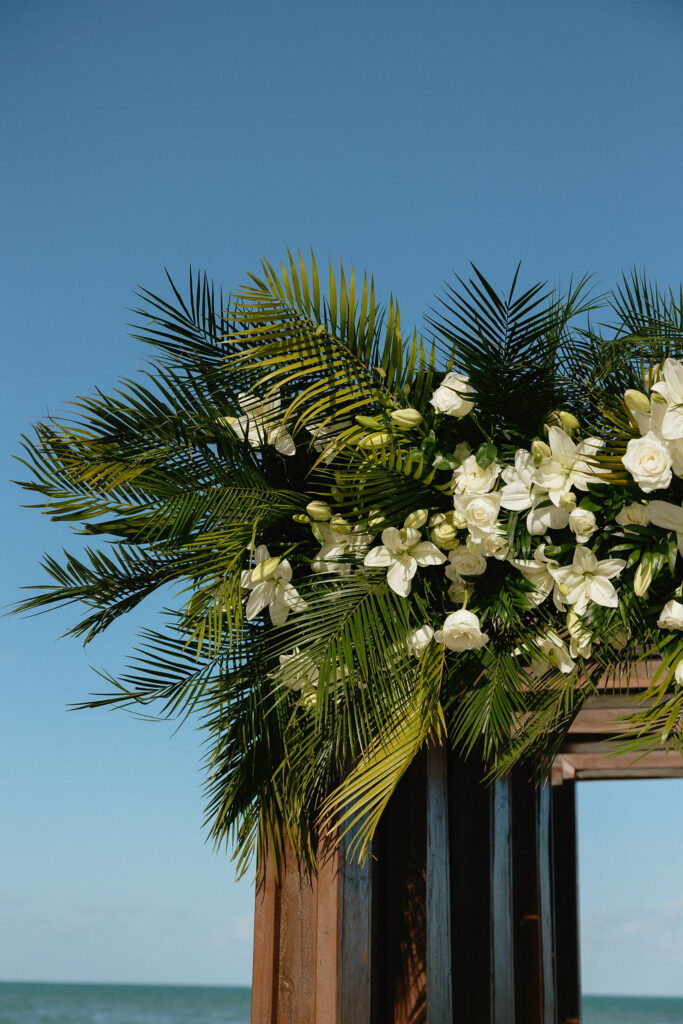 White floral decor for a ceremony at Secrets Playa Blanca 