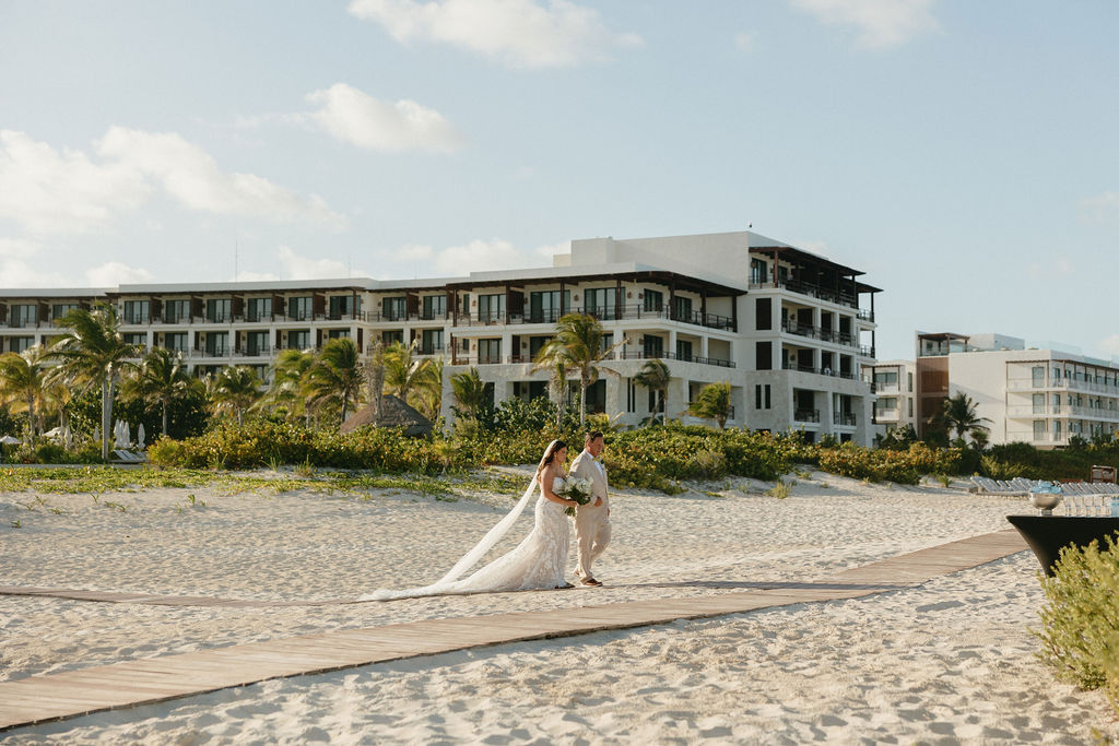 Father of the bride walking his daughter down the aisle for her ceremony at Secrets Playa Blanca 