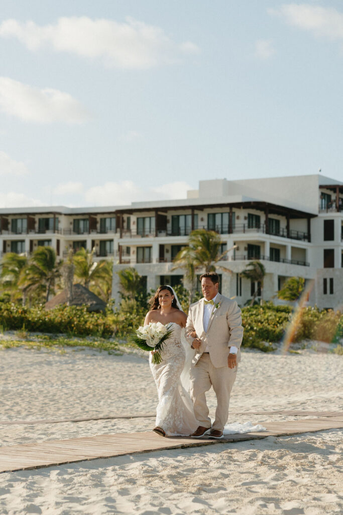 Bride's father walking her down the aisle at Secrets Playa Blanca