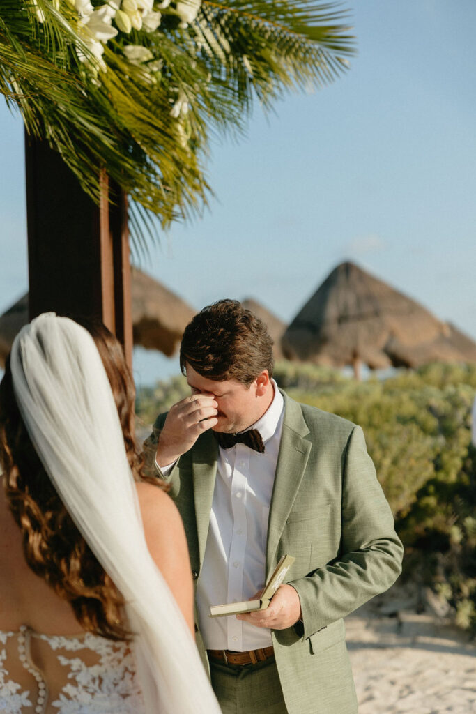Groom emotional during his vow reading at Secrets Playa Blanca 