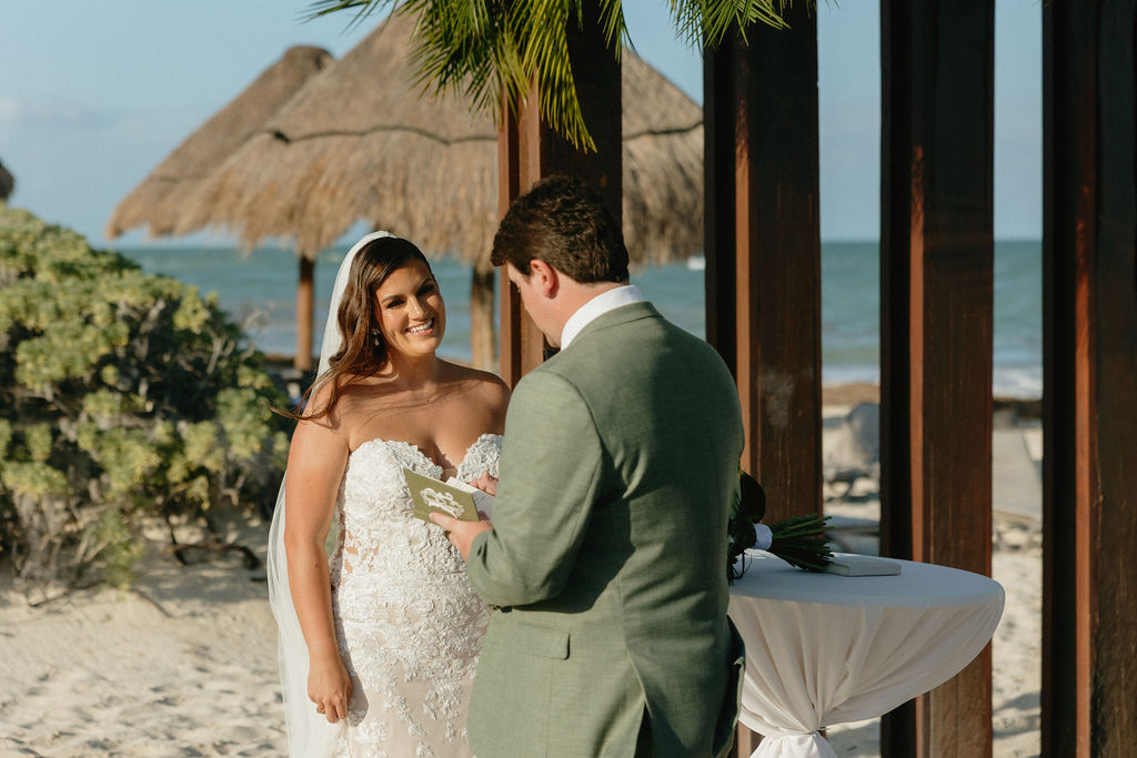 Groom reading vows to bride during Secrets Playa Blanca wedding