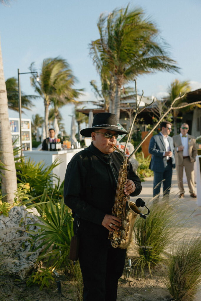 Musician plays a saxophone during a reception party at Secrets Playa Blanca