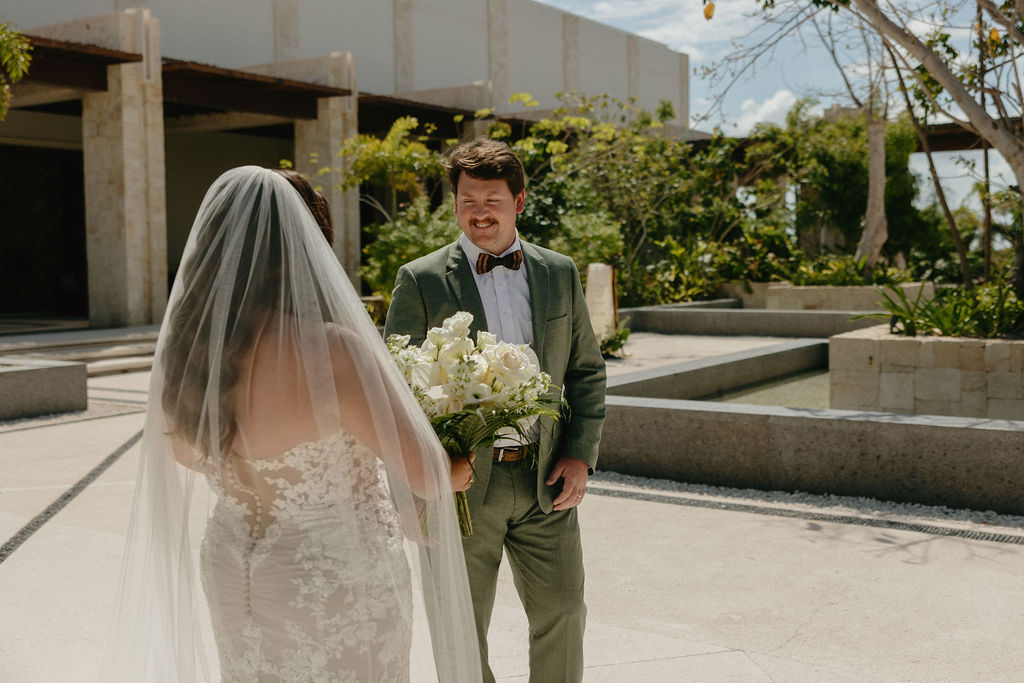 A husband and wives first look for their Secrets Playa Blanca wedding