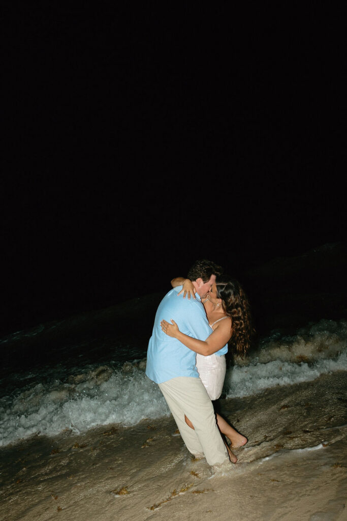 Bride and groom kissing in the ocean in Cancun Mexico at Secrets Playa Blanca 