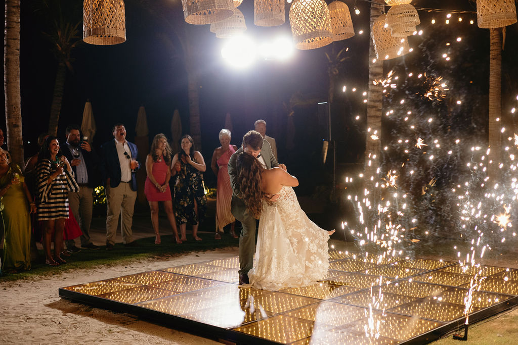 Bride and groom dancing during sparklers at their Secrets Playa Blanca wedding