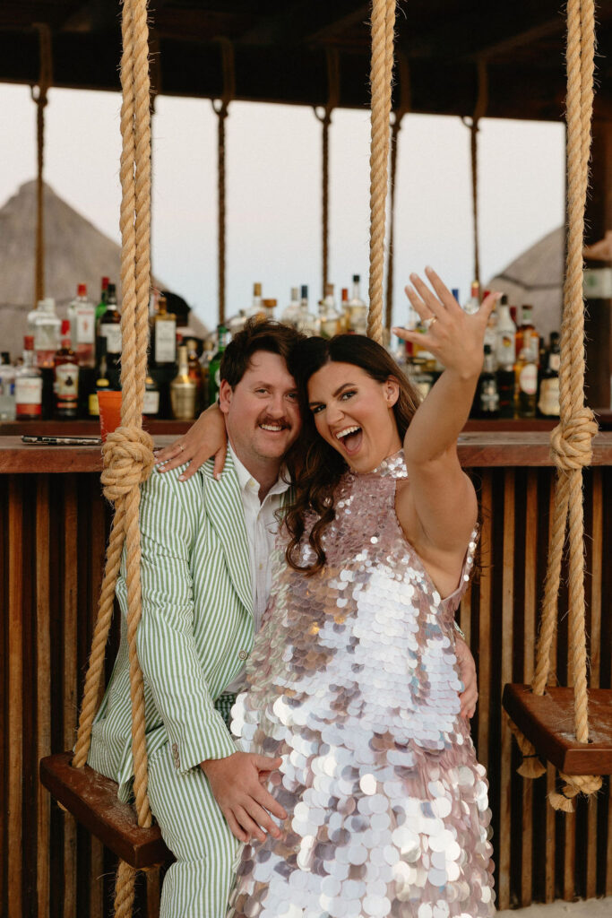 Woman sitting on mans lap in a swing