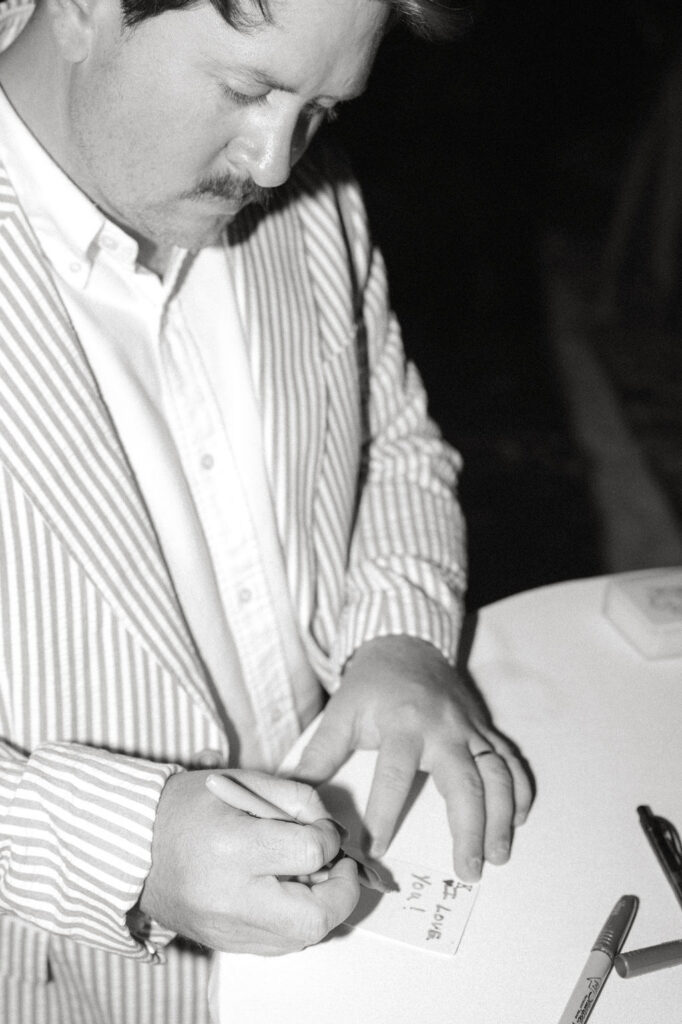 Man writing a note to his future wife
